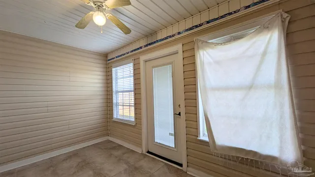 a white toilet sitting next to a bath tub