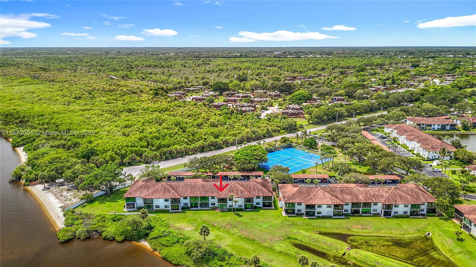6082 Southeast Landing Way, Unit 11 Stuart, FL 34997 - Photo 12 of 57 a view of an outdoor space and lakeside