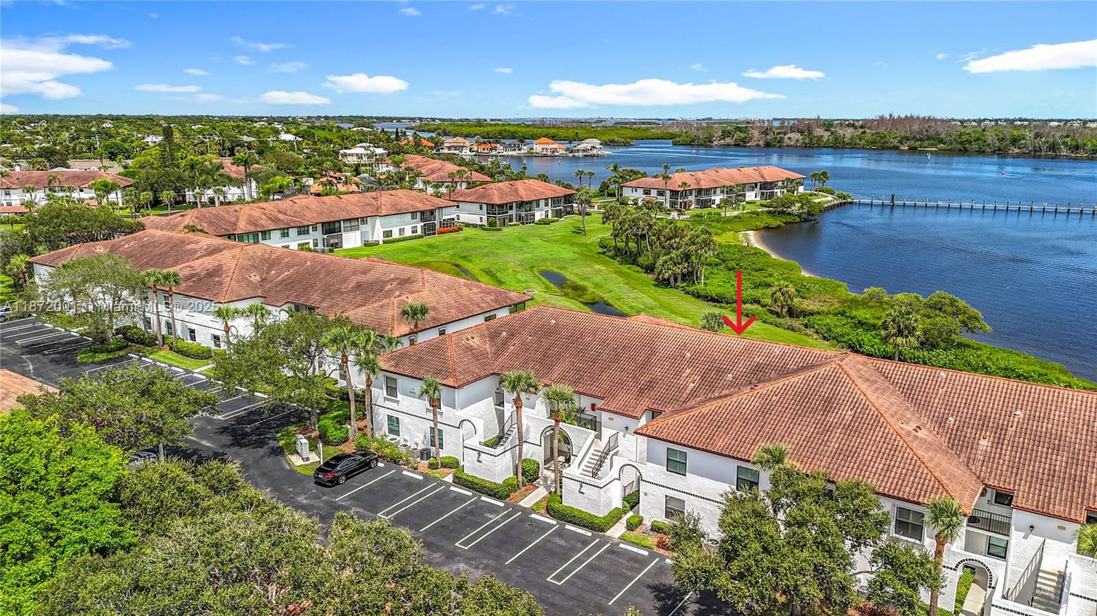 6082 Southeast Landing Way, Unit 11 Stuart, FL 34997 - Photo 19 of 57 an aerial view of a houses with outdoor space and ocean view