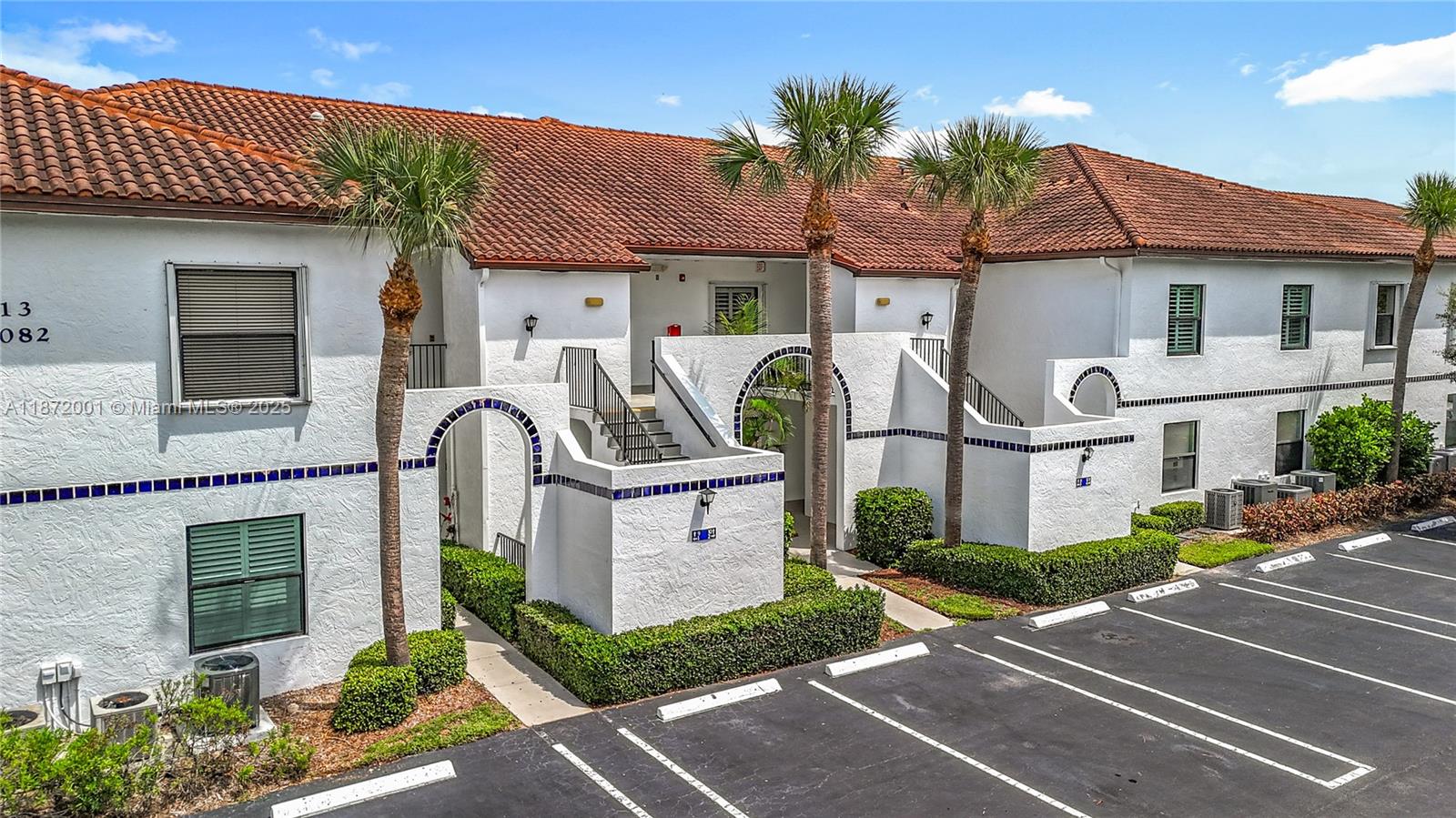 6082 Southeast Landing Way, Unit 11 Stuart, FL 34997 - Photo 20 of 57 a front view of a house with garden