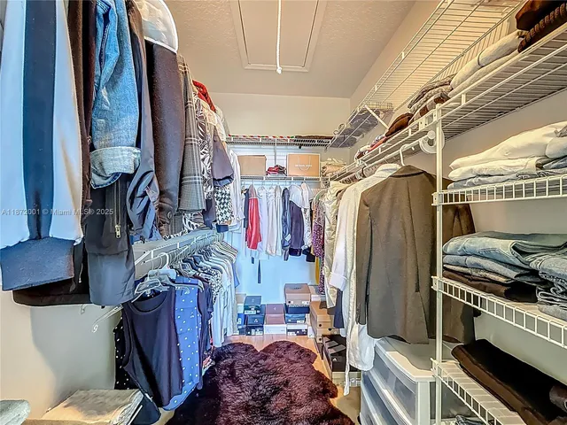 a view of a kitchen cabinets and wooden floor