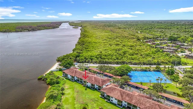 a view of a house with a yard and a garden