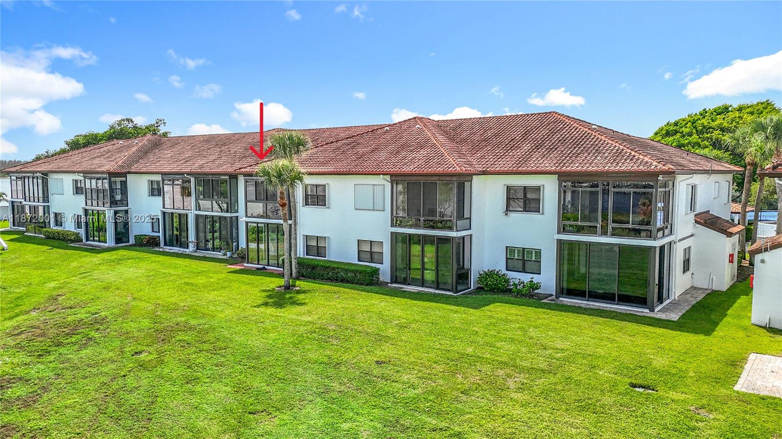 6082 Southeast Landing Way, Unit 11 Stuart, FL 34997 - Photo 10 of 57 a view of a house with a yard and a garden