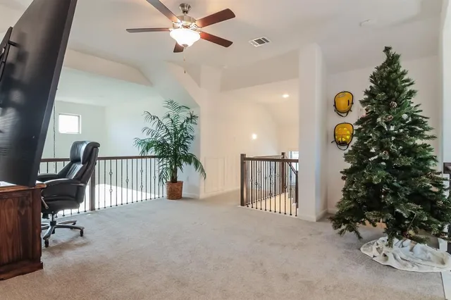 a view of a livingroom with furniture and a potted plant