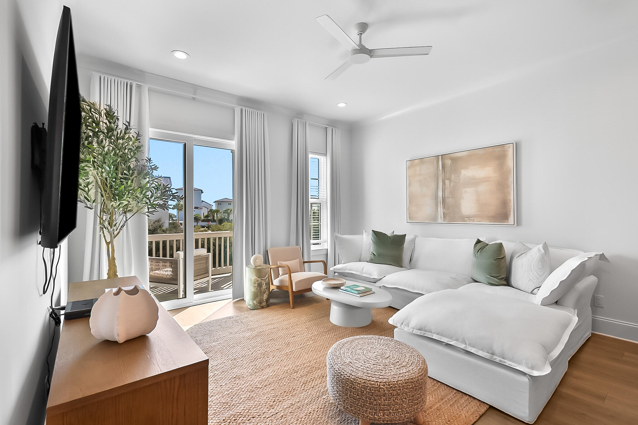 a living room with furniture and a flat screen tv