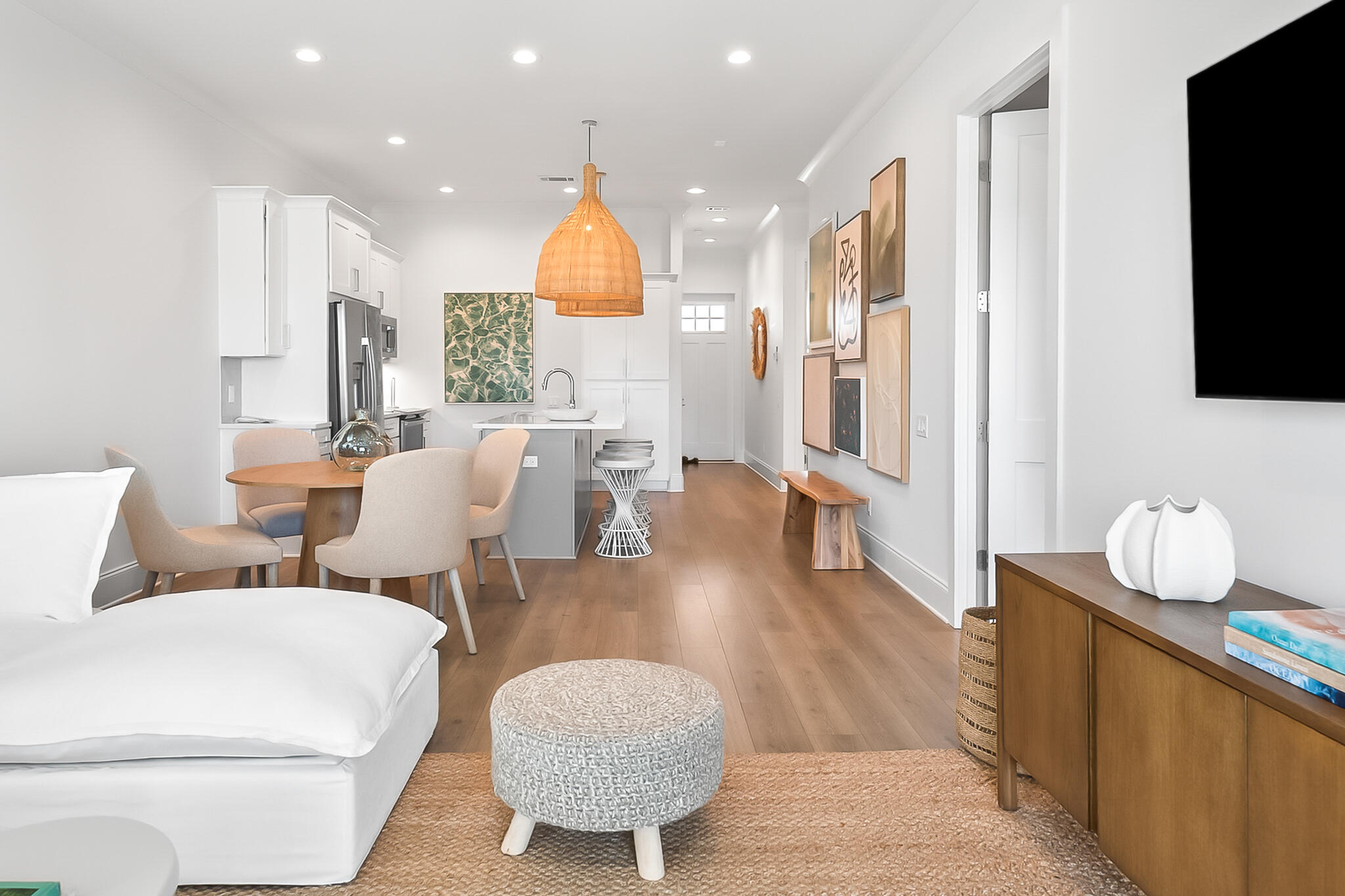 70 Marthas Lane, Unit 2204 Santa Rosa Beach, FL 32459 - Photo 11 of 29 a living room with furniture a flat screen tv and kitchen view