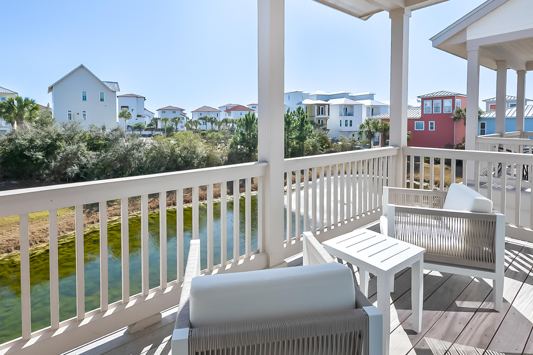 70 Marthas Lane, Unit 2204 Santa Rosa Beach, FL 32459 - Photo 23 of 29 a view of a balcony with two chairs and a table