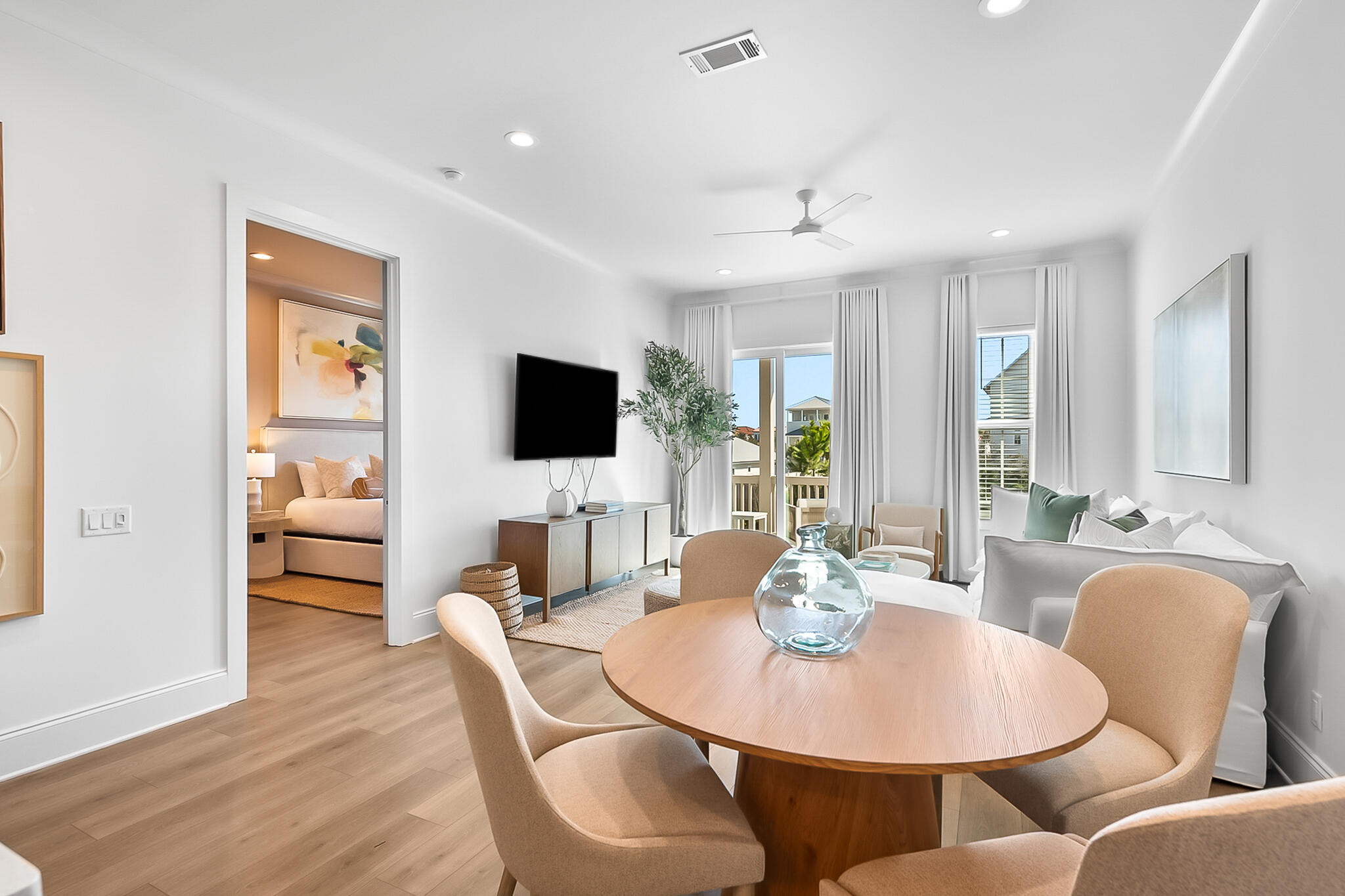 70 Marthas Lane, Unit 2204 Santa Rosa Beach, FL 32459 - Photo 9 of 29 a living room with furniture a flat screen tv and kitchen view