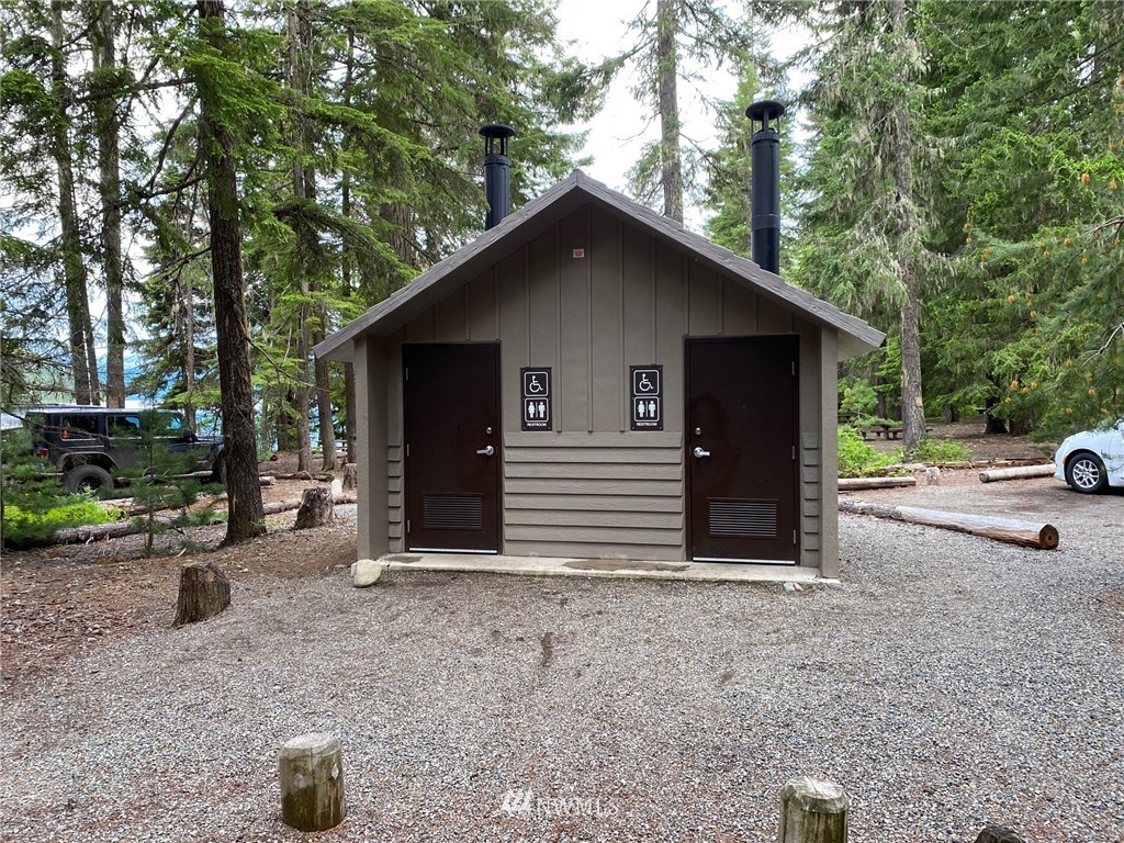 8711 Kachess Lake Road Easton, WA 98925 - Photo 21 of 24 a view of a house that has a car parked beside it