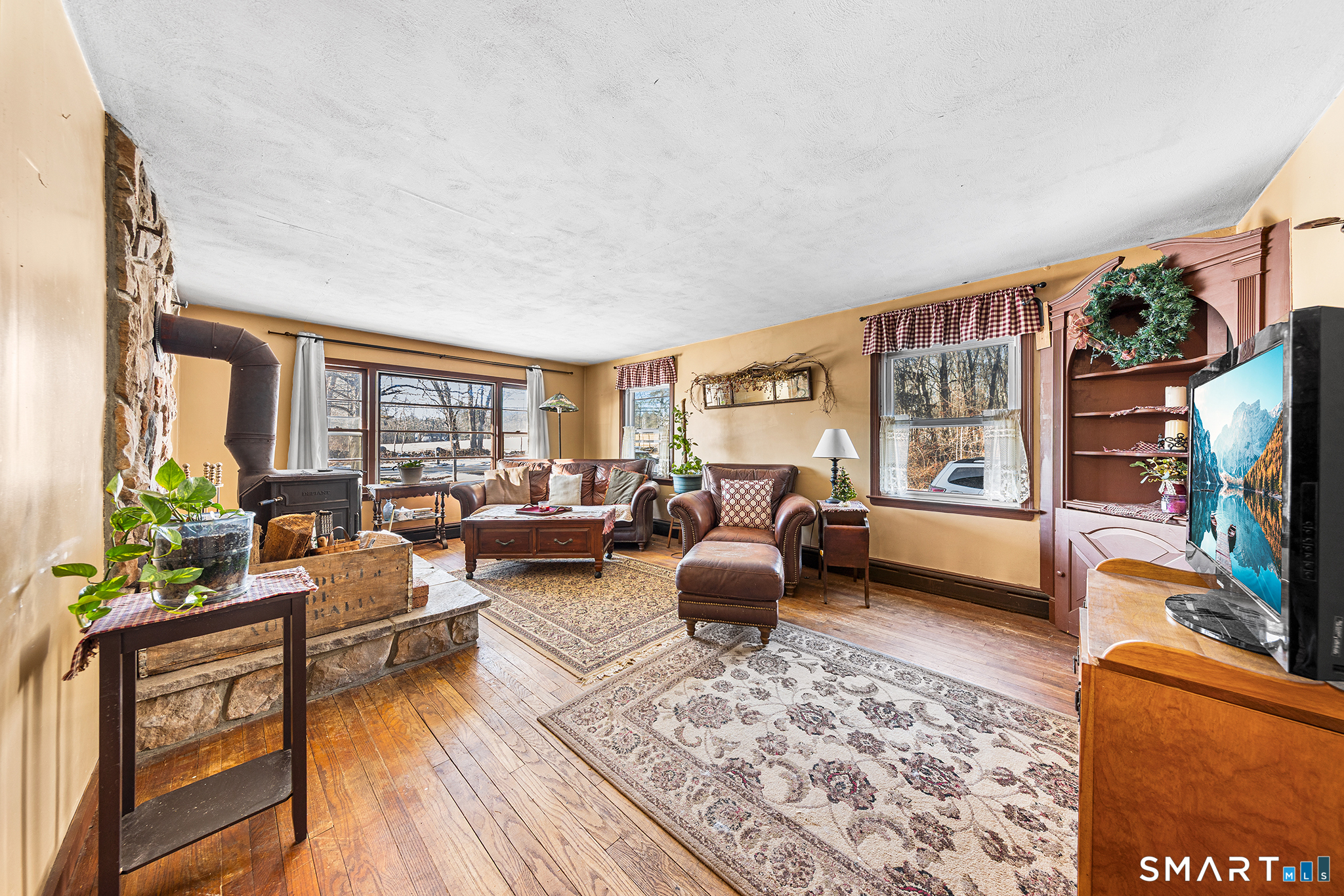 280 Village Hill Road Willington, CT 06279 - Photo 15 of 35 a living room with furniture and a flat screen tv