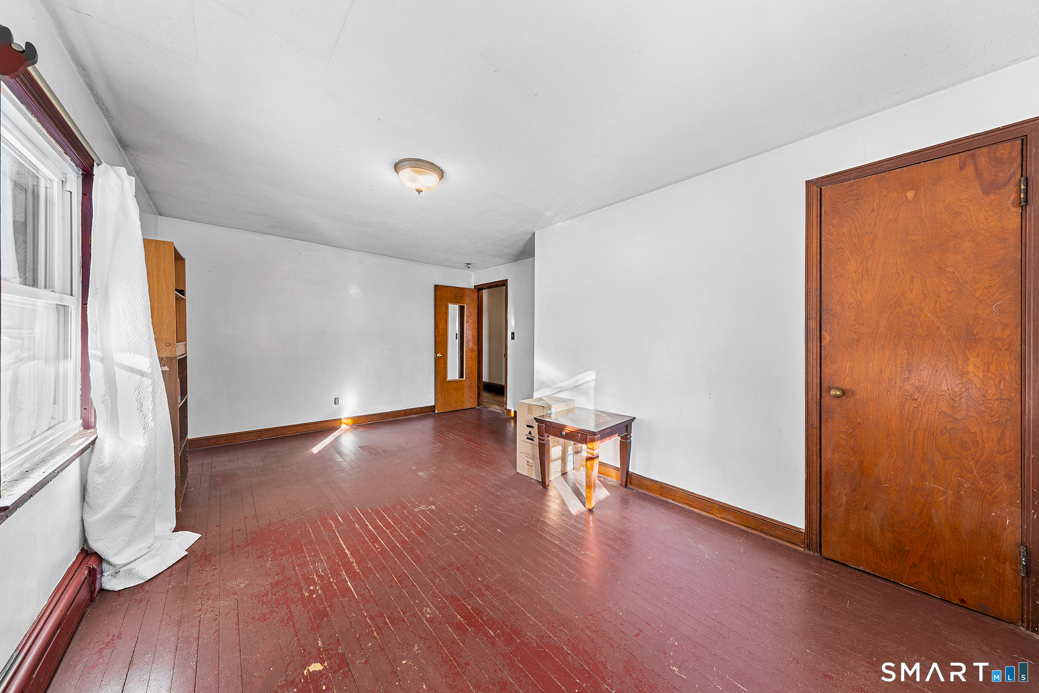 280 Village Hill Road Willington, CT 06279 - Photo 18 of 35 a view of an empty room with wooden floor and a window