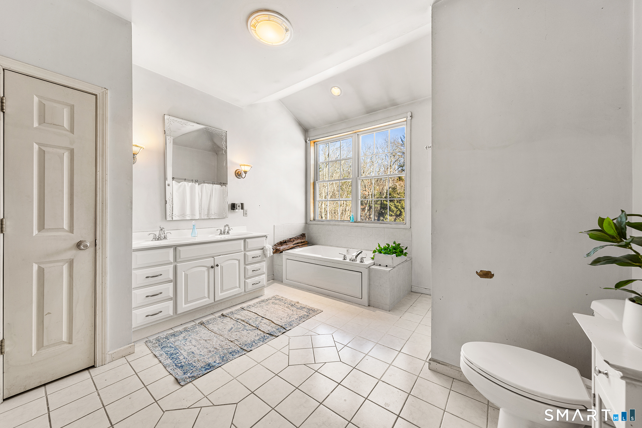 280 Village Hill Road Willington, CT 06279 - Photo 27 of 35 a spacious bathroom with a granite countertop toilet a sink a mirror a bathtub and a shower