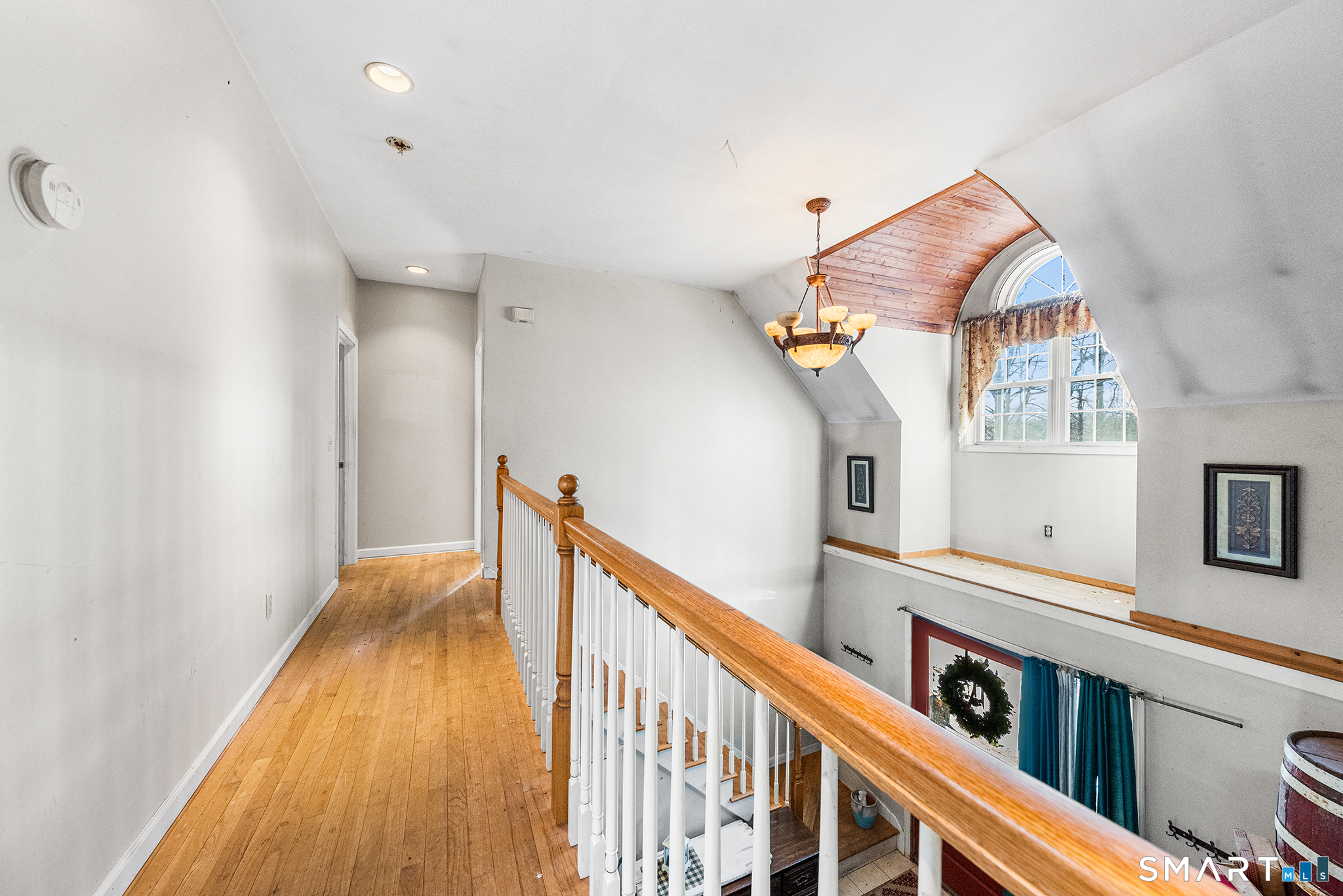 280 Village Hill Road Willington, CT 06279 - Photo 29 of 35 a view of a hallway with wooden floor and staircase