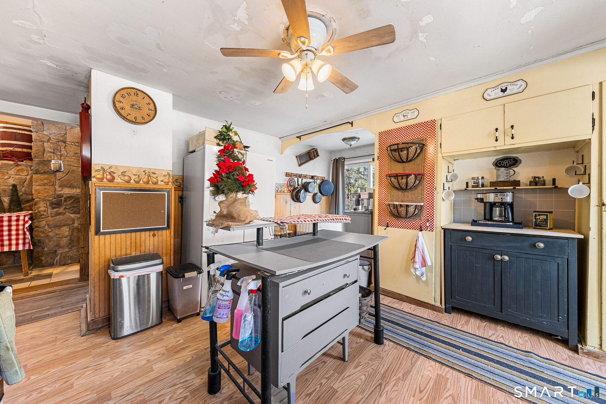 280 Village Hill Road Willington, CT 06279 - Photo 7 of 35 a view of a kitchen filled with furniture and wooden floor