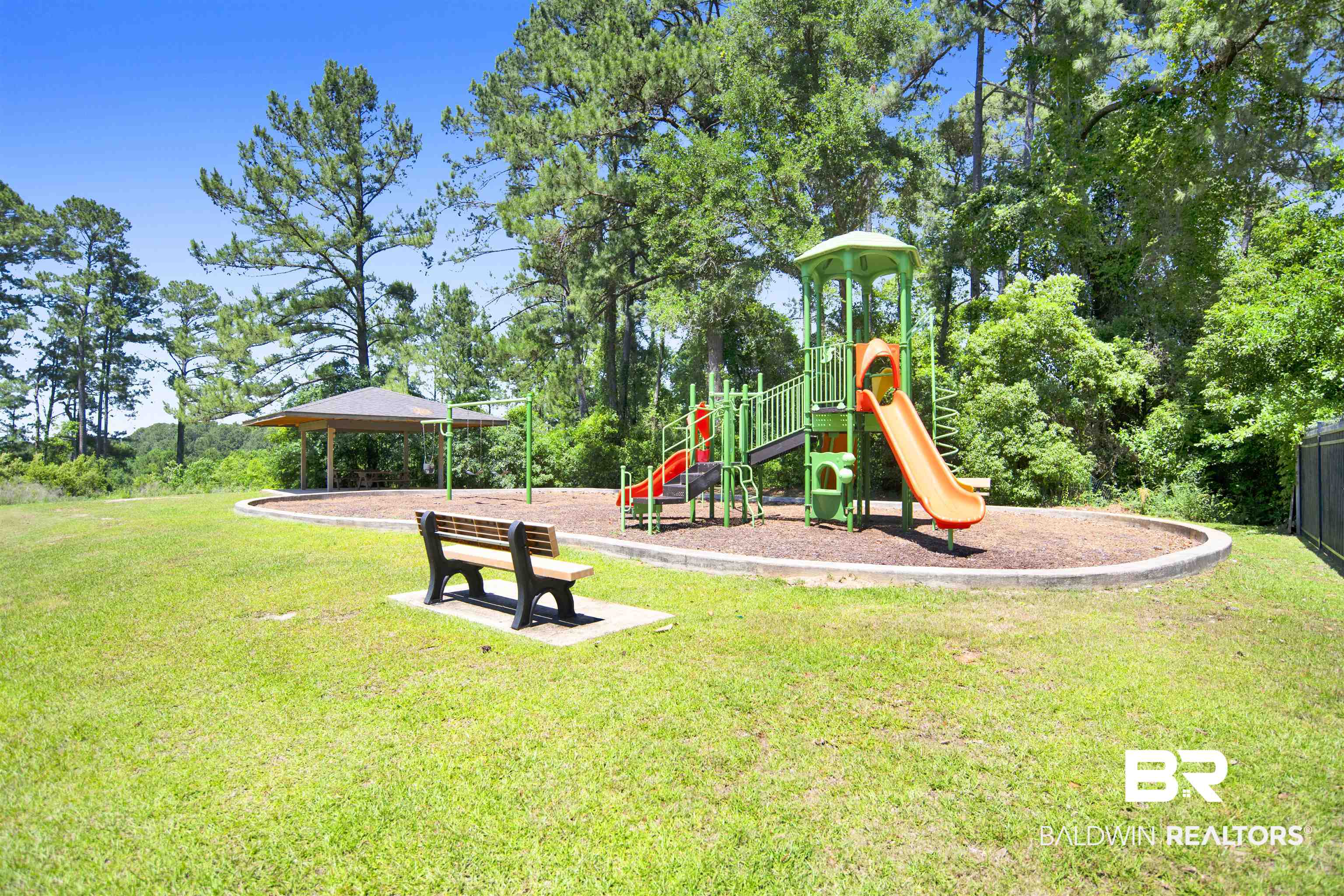 107 Virginia Circle Daphne, AL 36526 - Photo 39 of 47 Outdoor recreation area featuring a vibrant playground with multiple slides, a swingset, and a covered pavilion