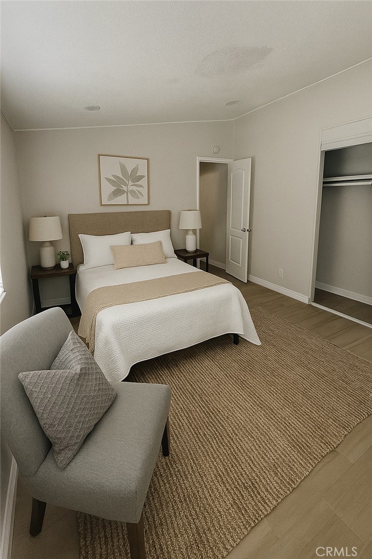 13340 Mesquite Road Whitewater, CA 92282 - Photo 6 of 15 a bedroom with a bed and wooden floor