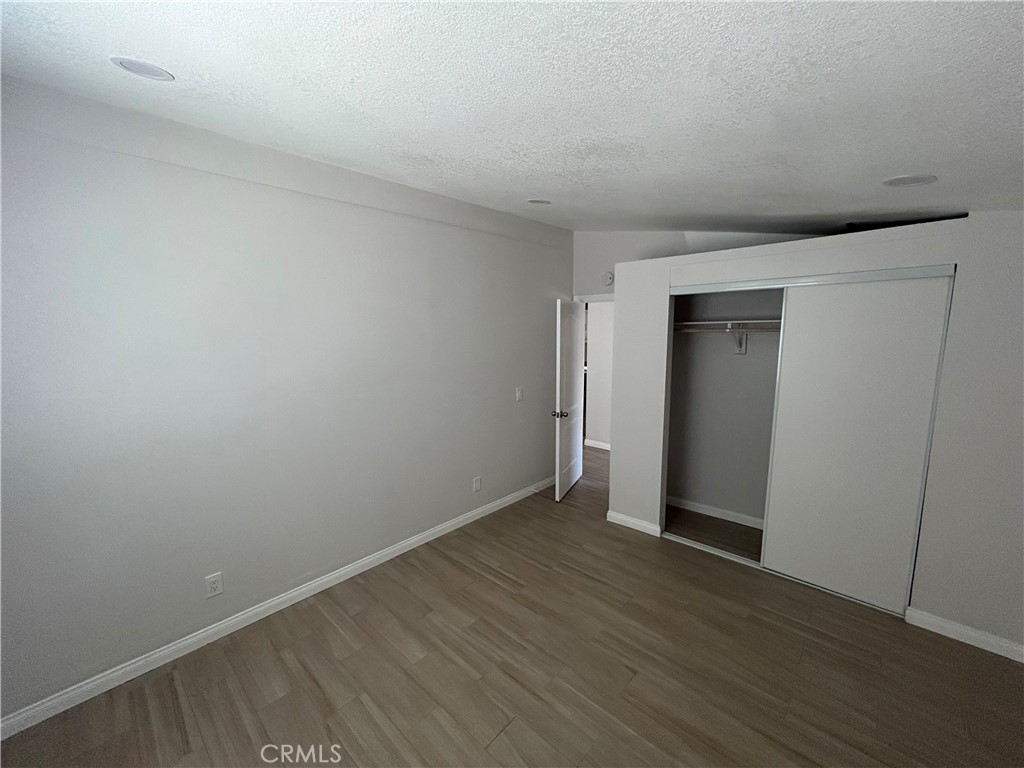 13340 Mesquite Road Whitewater, CA 92282 - Photo 8 of 15 a view of an empty room with wooden floor and closet