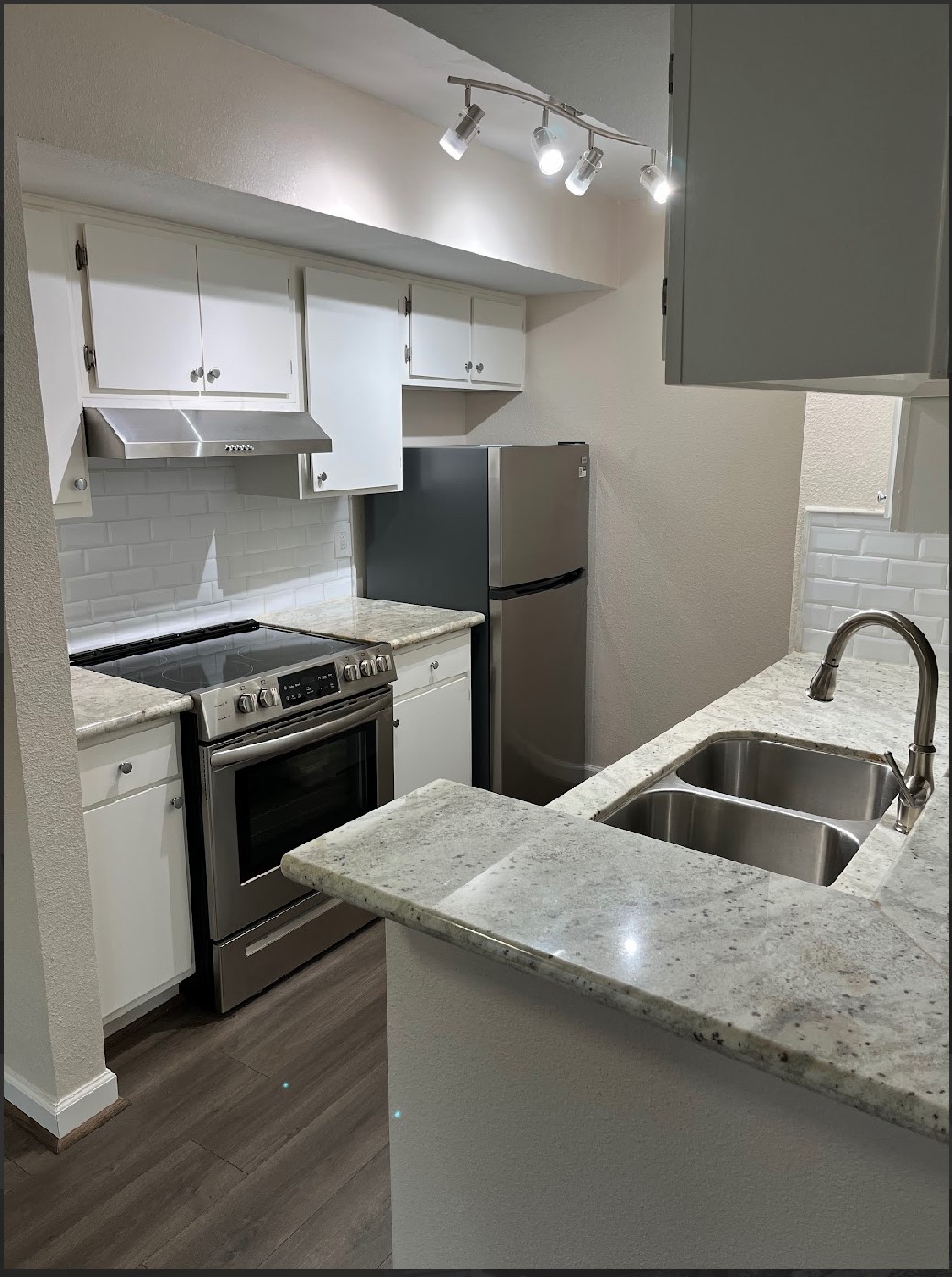 2800 Jeanetta Street, Unit 2706 Houston, TX 77063 - Photo 1 of 19 a kitchen with stainless steel appliances granite countertop a sink and a refrigerator