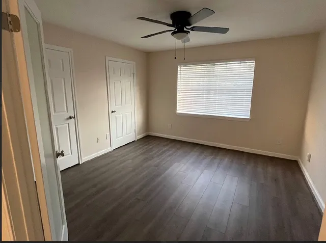 a view of room window and wooden floor