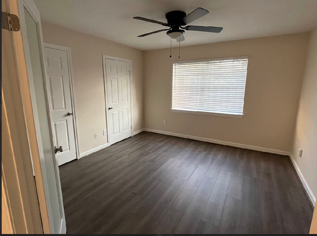 2800 Jeanetta Street, Unit 2706 Houston, TX 77063 - Photo 12 of 19 a view of room window and wooden floor