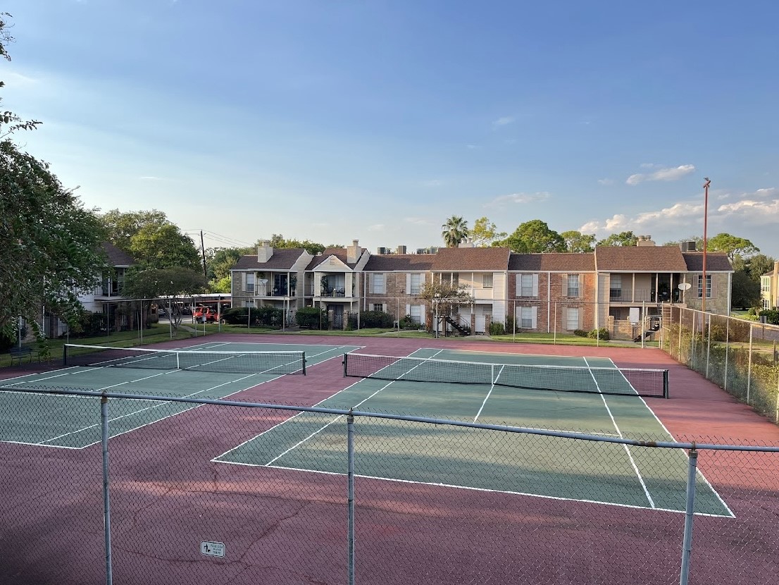 2800 Jeanetta Street, Unit 2706 Houston, TX 77063 - Photo 17 of 19 a view of a tennis ground with large trees