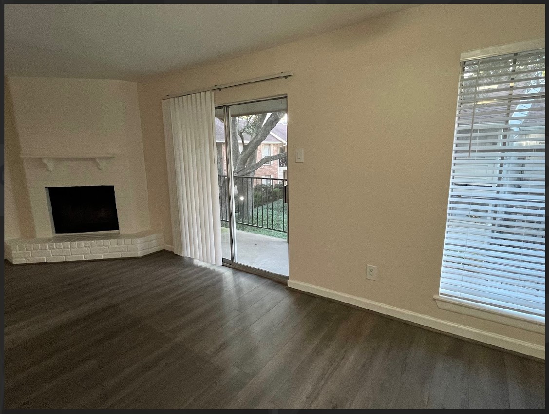 2800 Jeanetta Street, Unit 2706 Houston, TX 77063 - Photo 5 of 19 a view of an empty room with wooden floor and a window