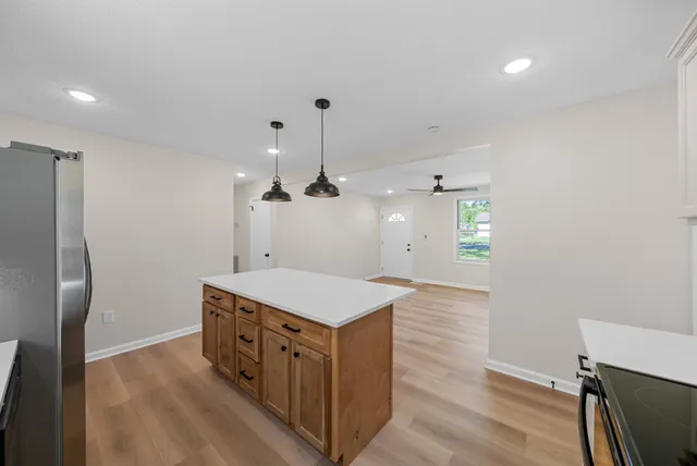 a kitchen that has a lot of cabinets in it