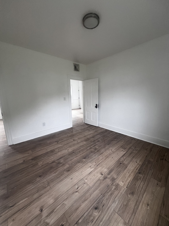 19 Reeves Street Worcester, MA 01607 - Photo 25 of 30 a view of a room with wooden floor and window