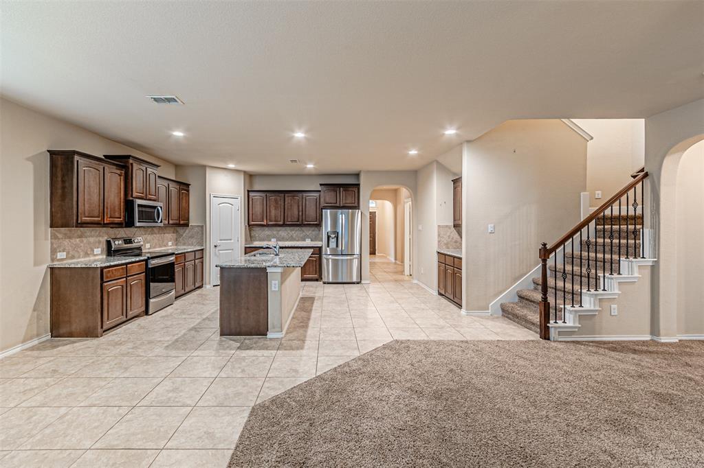 11460 Starlight Ranch Fort Worth, TX 76052 - Photo 11 of 33 a view of kitchen with microwave stove refrigerator and microwave