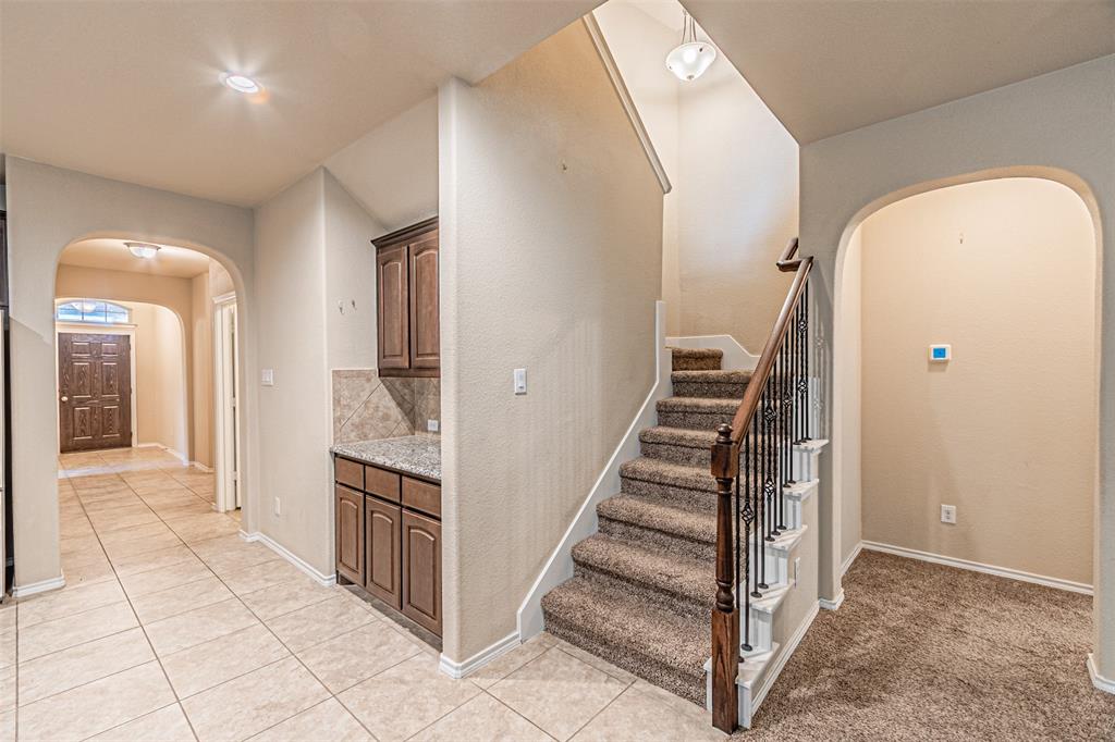 11460 Starlight Ranch Fort Worth, TX 76052 - Photo 12 of 33 a view of a hallway with entryway and stairs