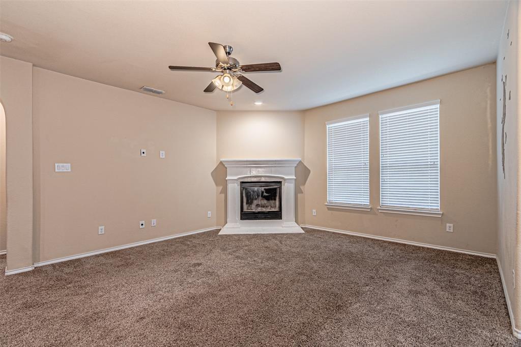 11460 Starlight Ranch Fort Worth, TX 76052 - Photo 14 of 33 an empty room with windows and fireplace
