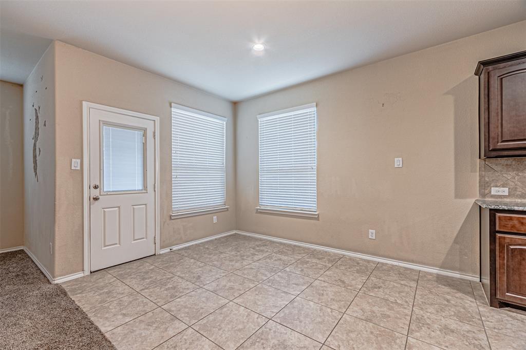 11460 Starlight Ranch Fort Worth, TX 76052 - Photo 15 of 33 a view of an empty room with a fireplace