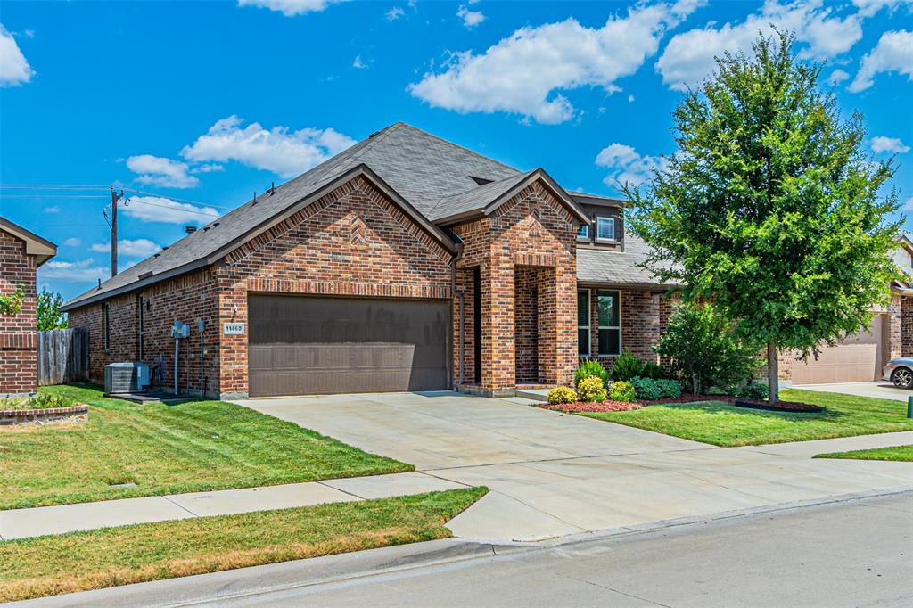 11460 Starlight Ranch Fort Worth, TX 76052 - Photo 2 of 33 a front view of a house with a yard and garage