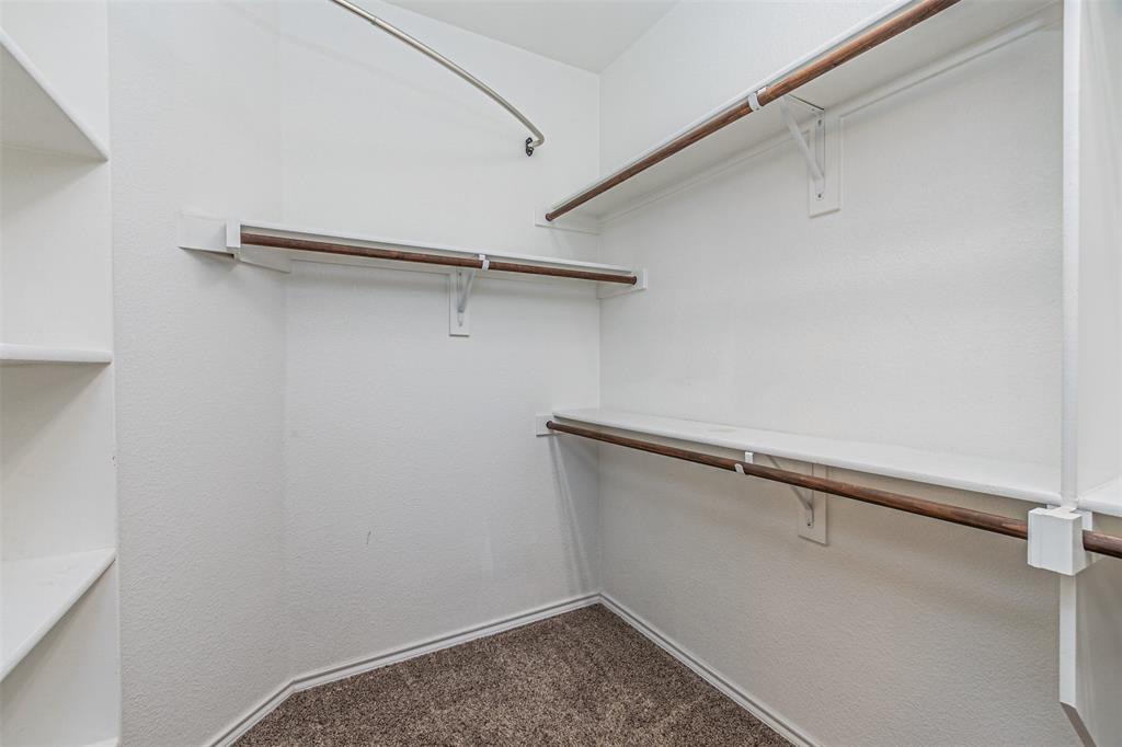 11460 Starlight Ranch Fort Worth, TX 76052 - Photo 21 of 33 a view of a room with racks on the wall