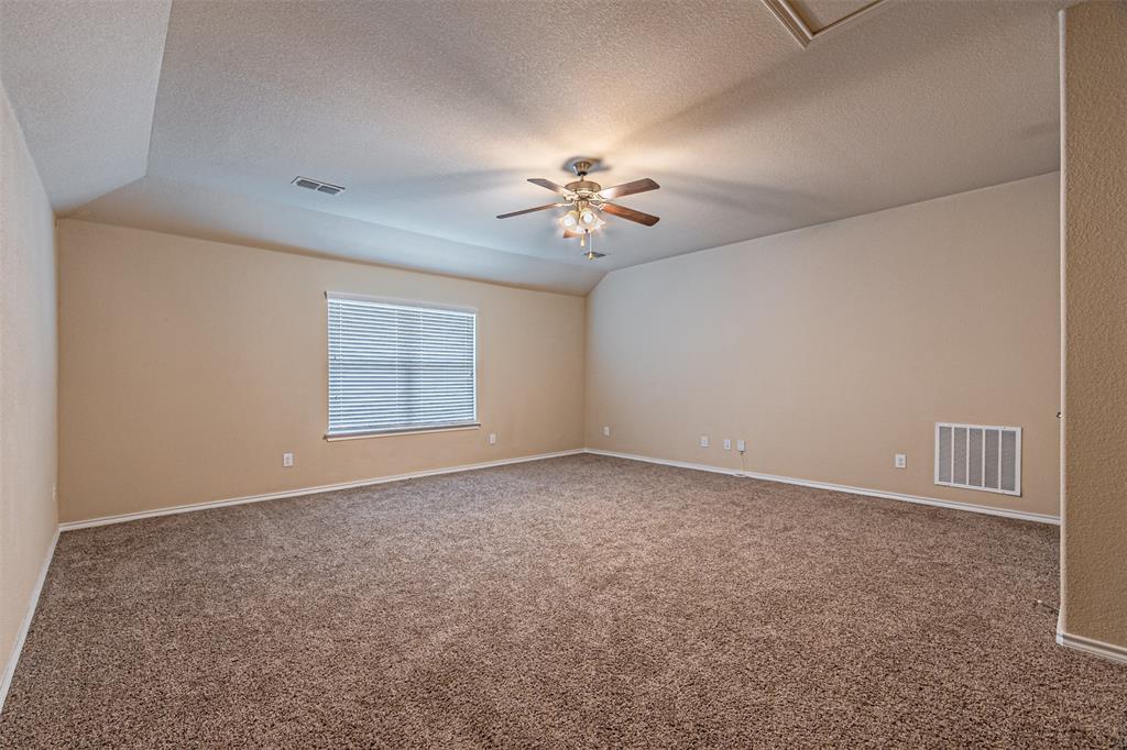 11460 Starlight Ranch Fort Worth, TX 76052 - Photo 26 of 33 an empty room with windows and fan