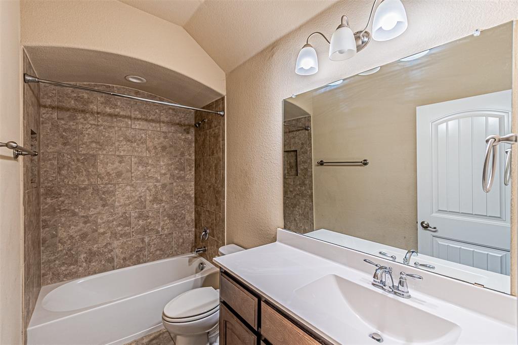 11460 Starlight Ranch Fort Worth, TX 76052 - Photo 29 of 33 a bathroom with a sink a toilet and shower