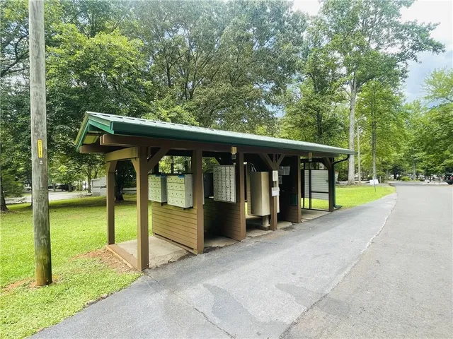a view of a patio with a table and chairs