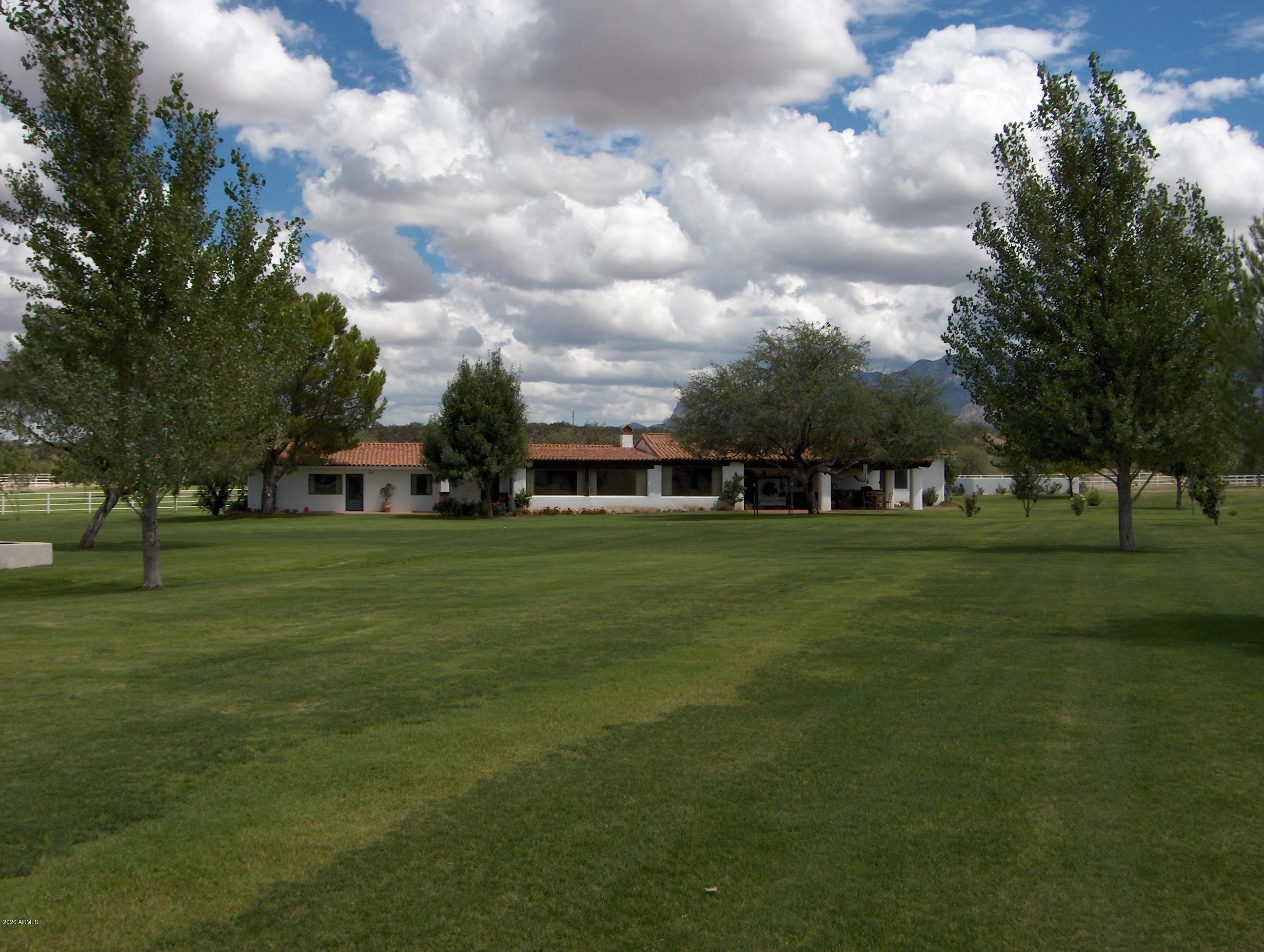 131-2 Amado Montosa Road Amado, AZ 85645 - Photo 14 of 55 a front view of a house with garden