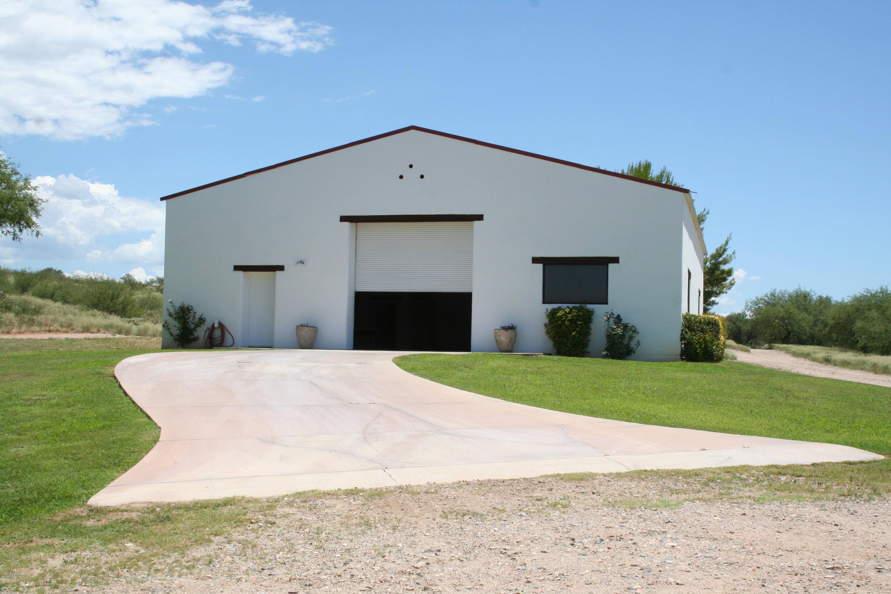 131-2 Amado Montosa Road Amado, AZ 85645 - Photo 18 of 55 a front view of a house with a yard