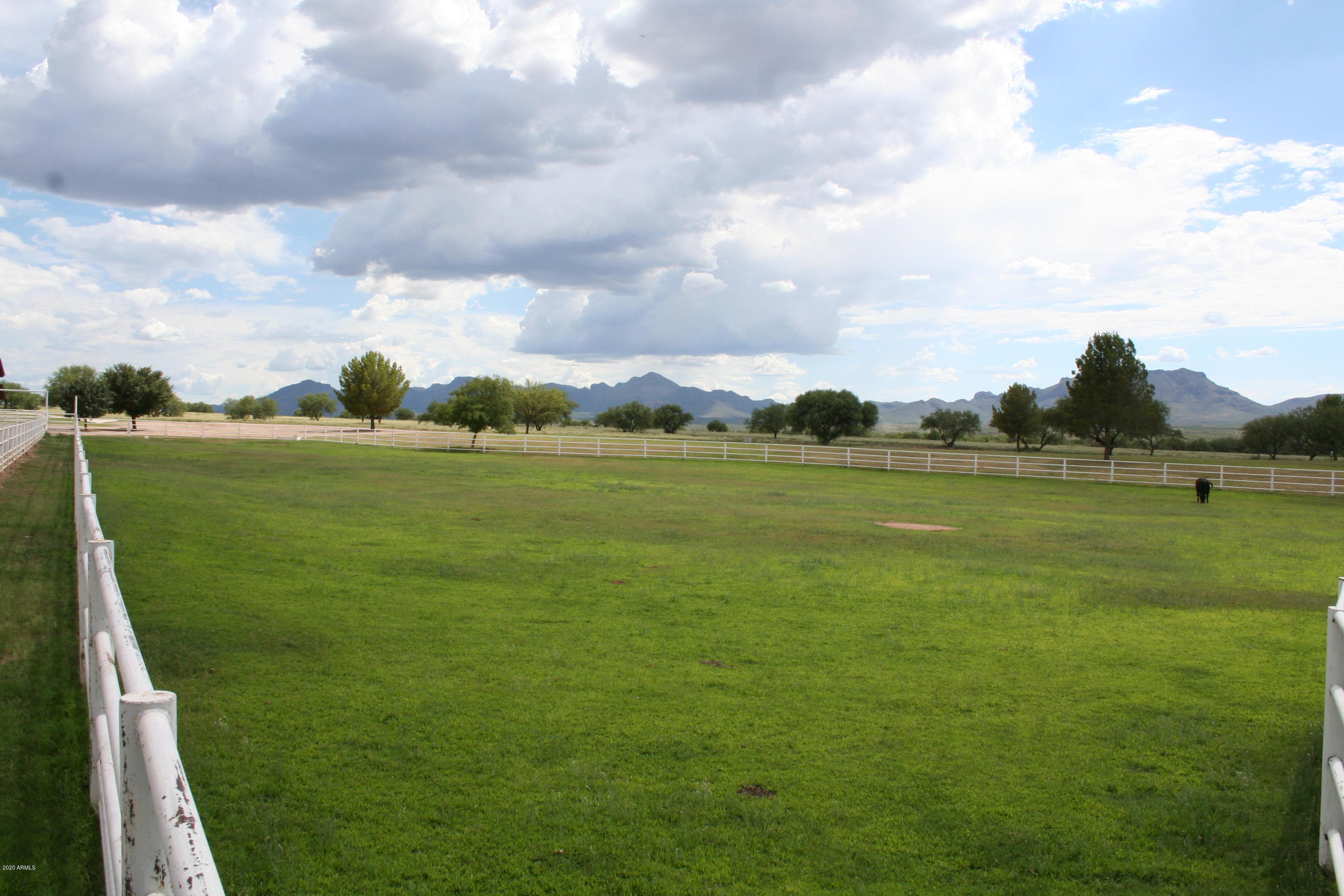 131-2 Amado Montosa Road Amado, AZ 85645 - Photo 26 of 55 a view of a golf course with a lake