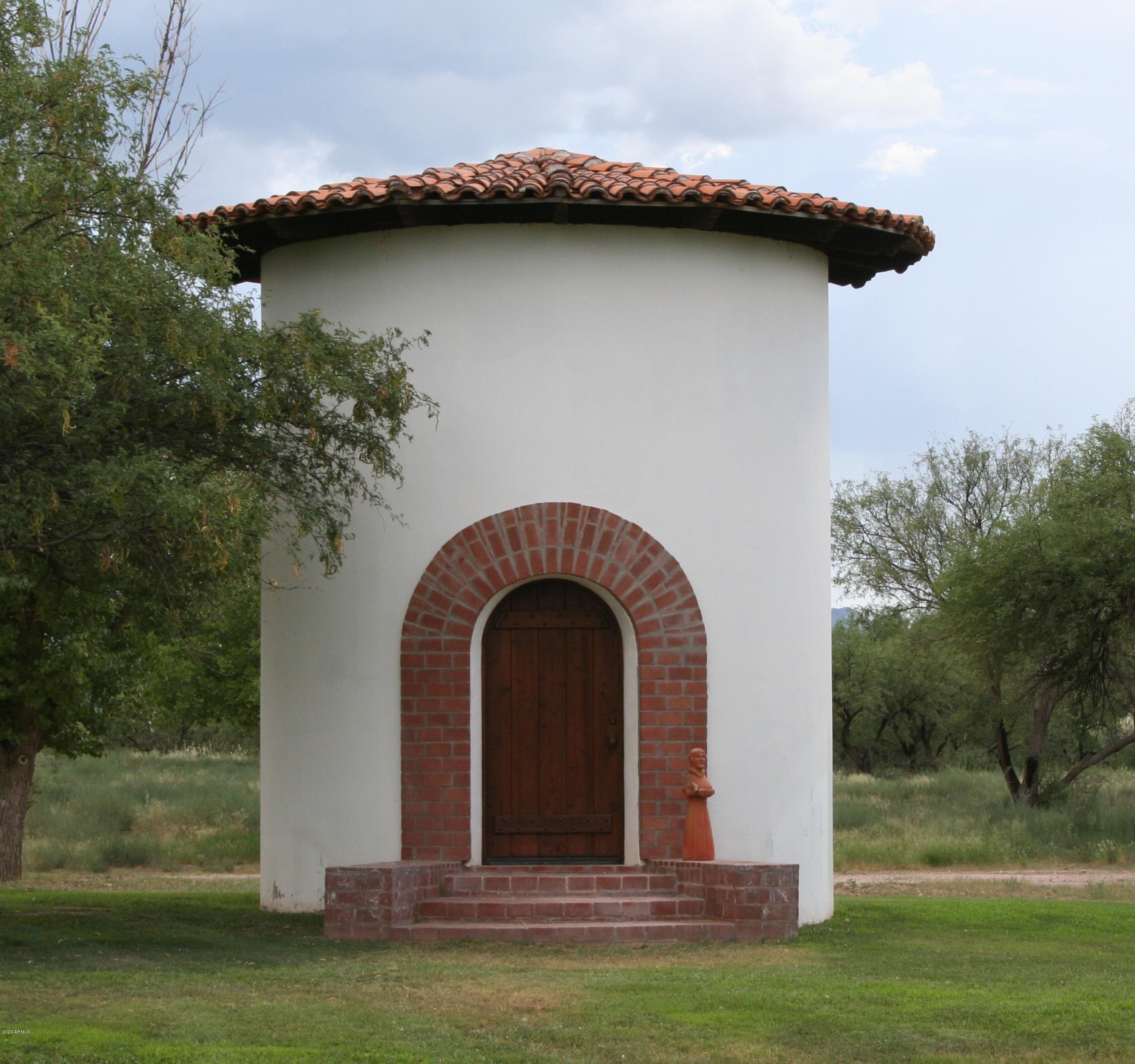 131-2 Amado Montosa Road Amado, AZ 85645 - Photo 28 of 55 a view of a wooden house with a yard