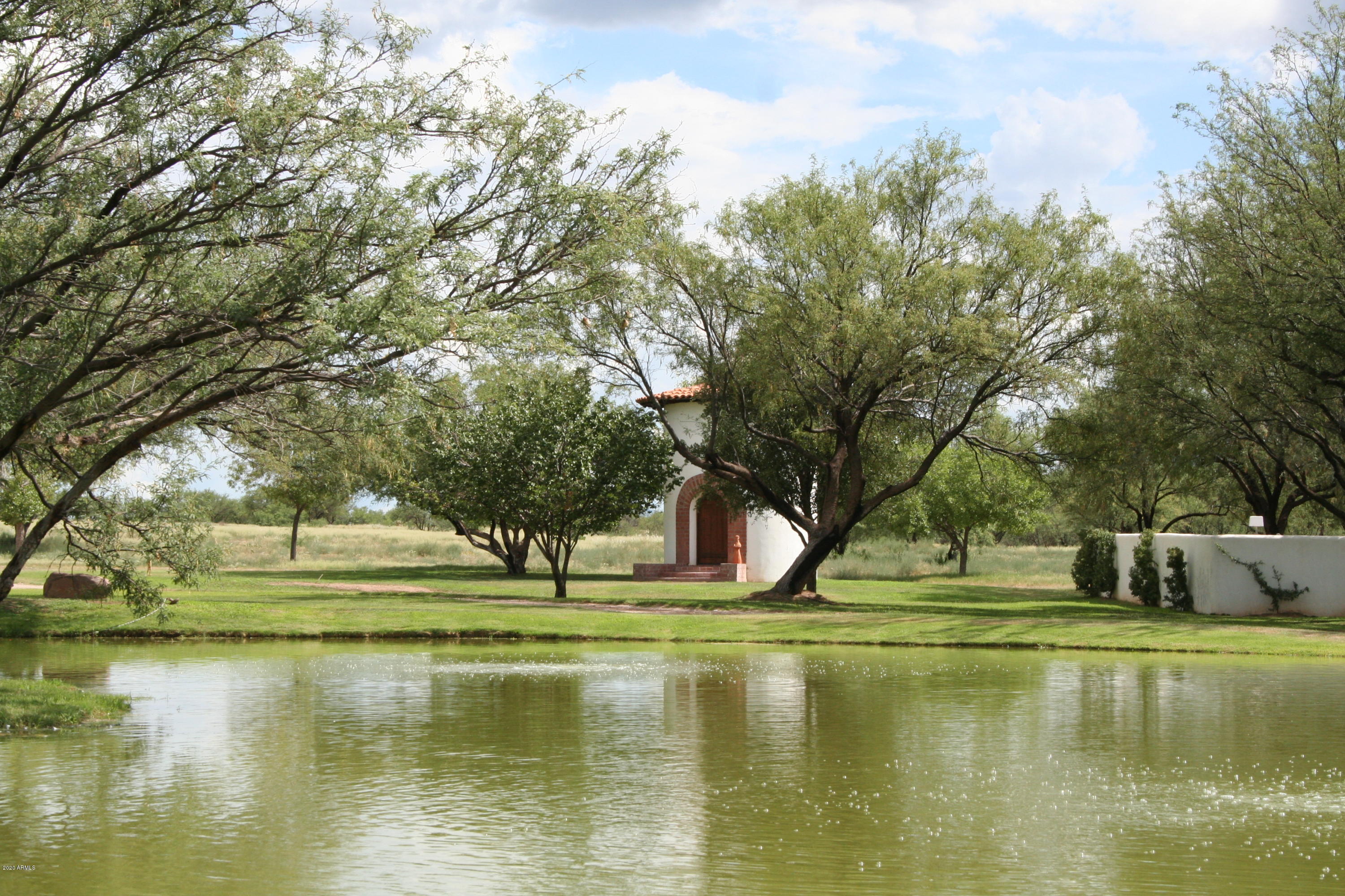 131-2 Amado Montosa Road Amado, AZ 85645 - Photo 29 of 55 a view of pool with water fountain and large trees