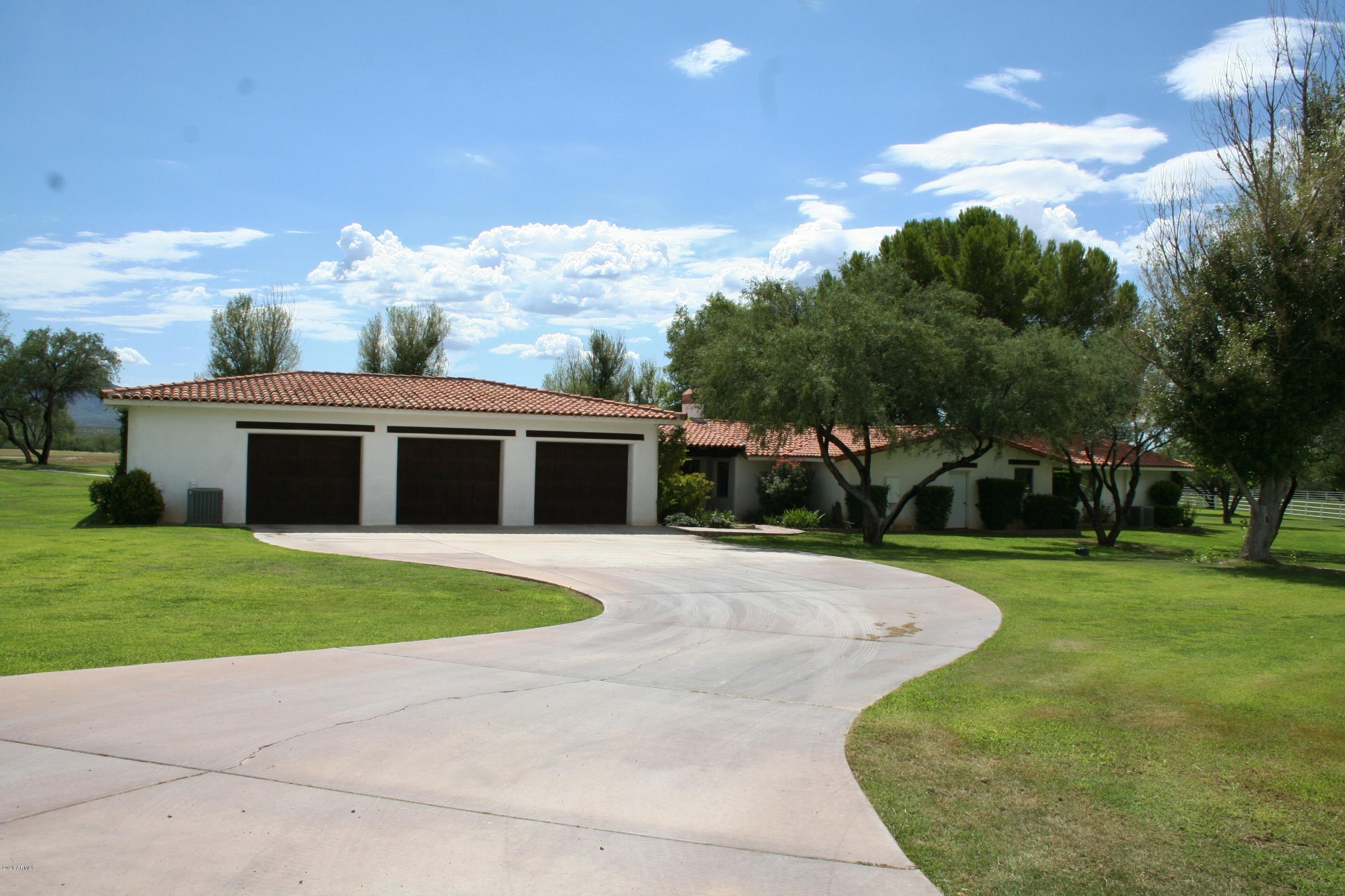 131-2 Amado Montosa Road Amado, AZ 85645 - Photo 31 of 55 a front view of a house with a yard and trees