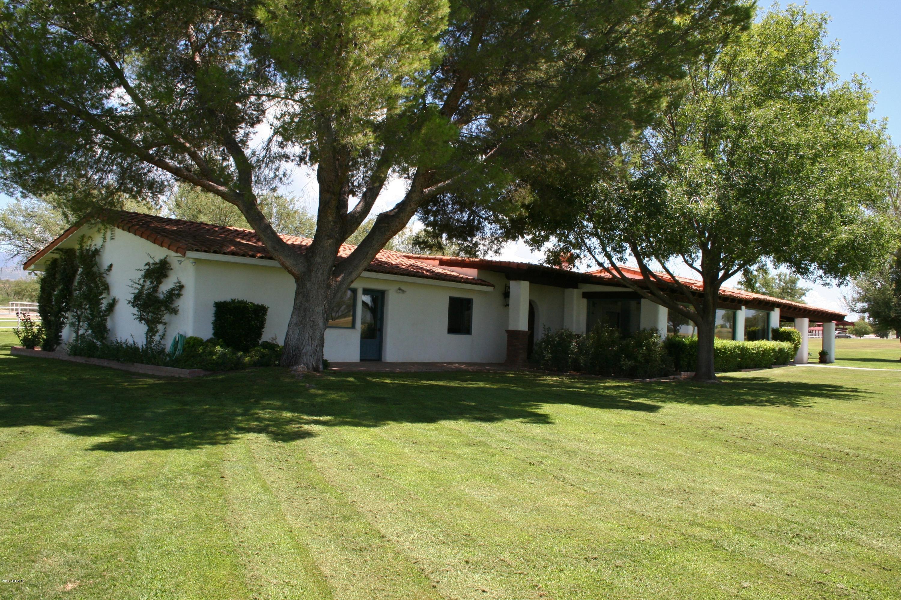 131-2 Amado Montosa Road Amado, AZ 85645 - Photo 40 of 55 a view of a backyard with large trees