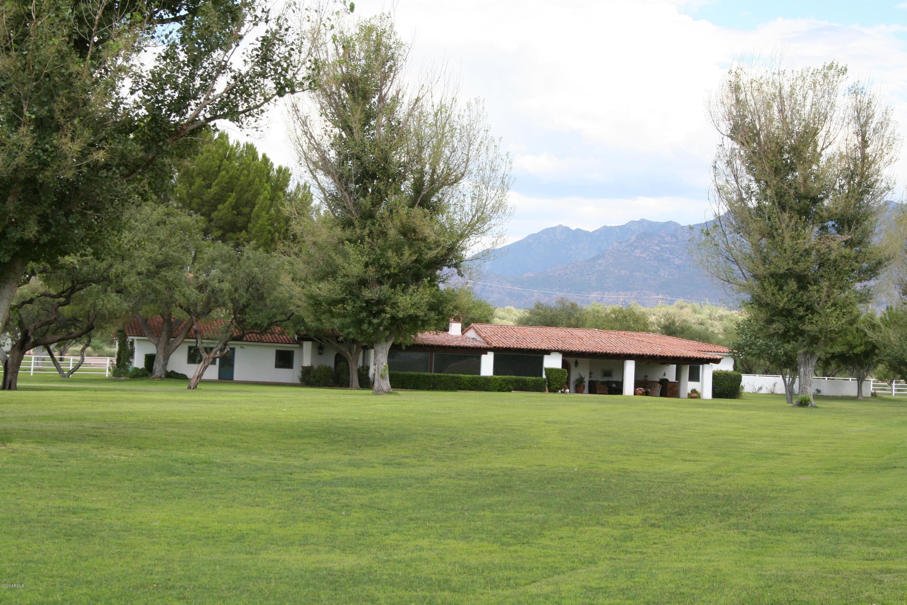 131-2 Amado Montosa Road Amado, AZ 85645 - Photo 41 of 55 a front view of house with yard and trees