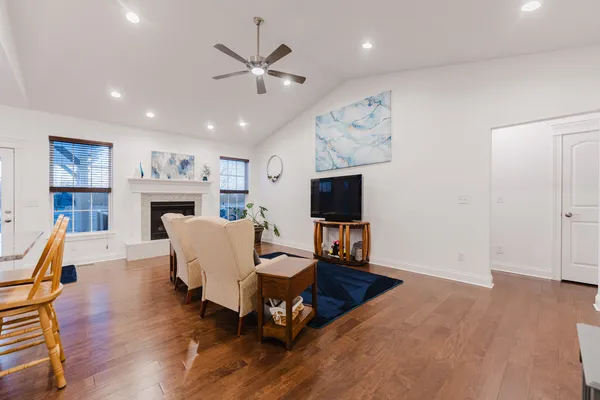 a living room with furniture a window and a fireplace