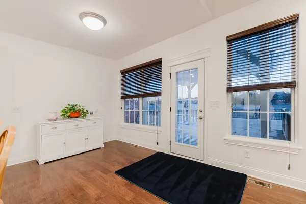a living room with lots of furniture and kitchen view