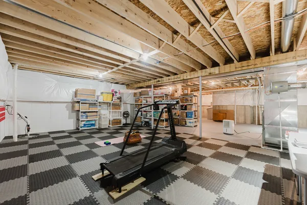 a view of a patio with table and chairs and wooden floor
