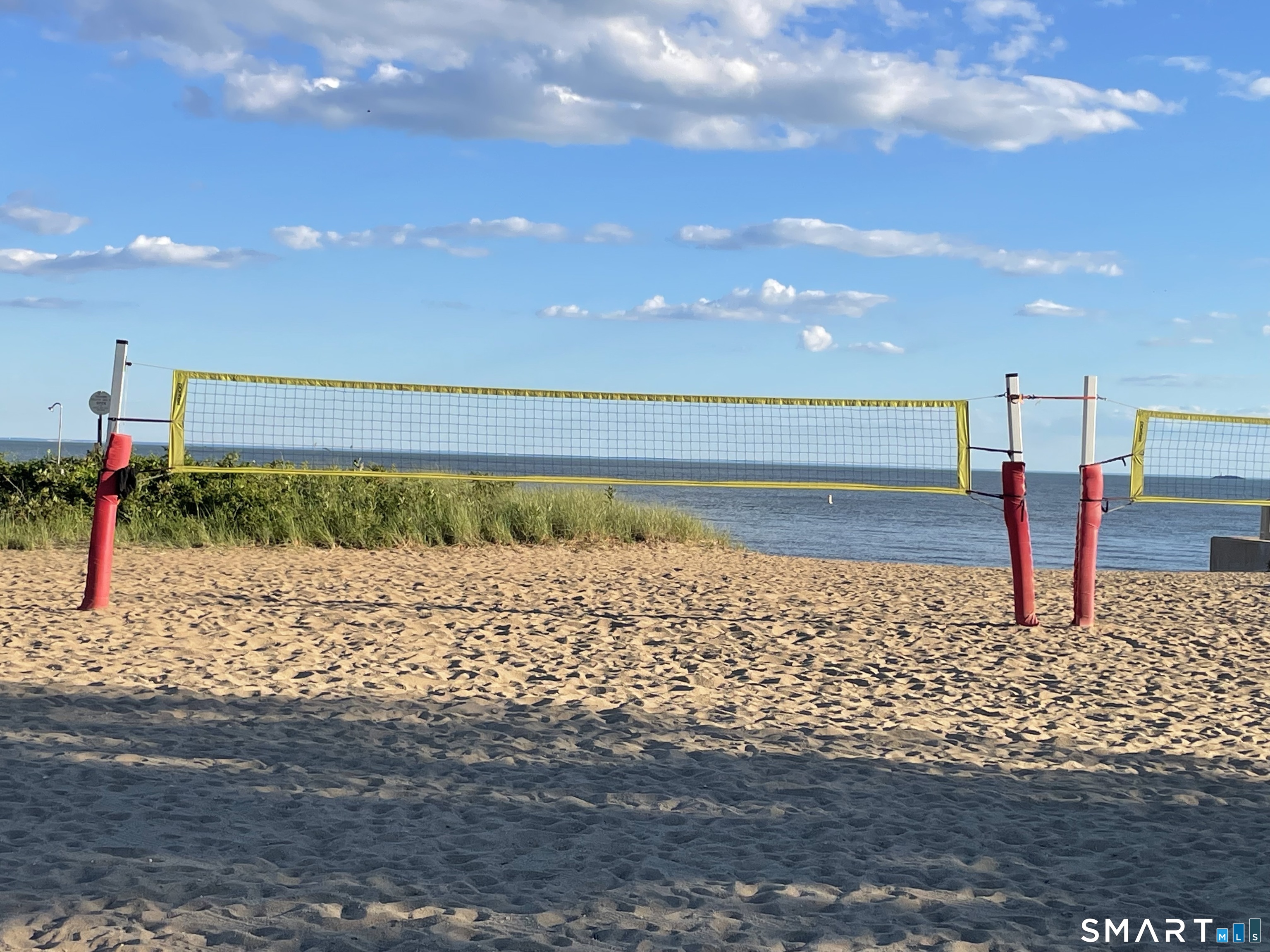 1023 Boston Post Road Madison, CT 06443 - Photo 27 of 38 Volleyball is a popular sport at the Surf Club.