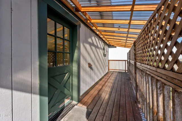 a view of balcony with furniture